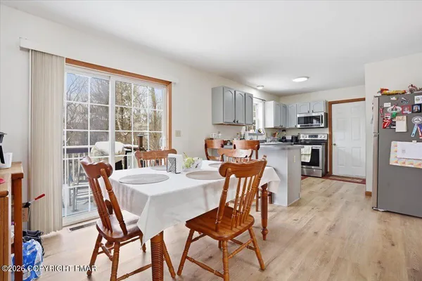 a living room with furniture window and a wooden floor