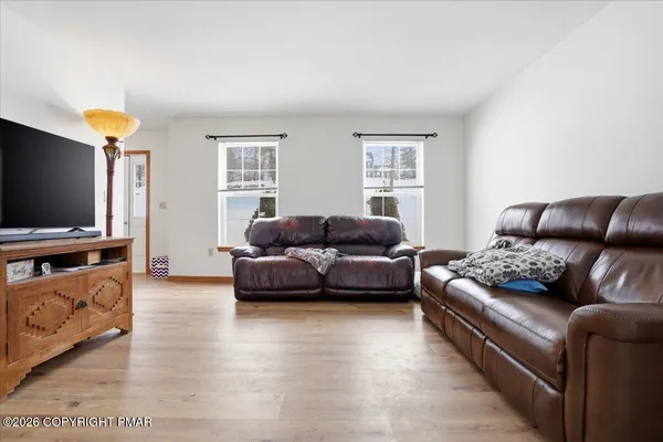 a spacious bedroom with a bed and a window