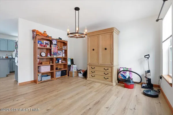 a kitchen with stainless steel appliances a stove a microwave and cabinets