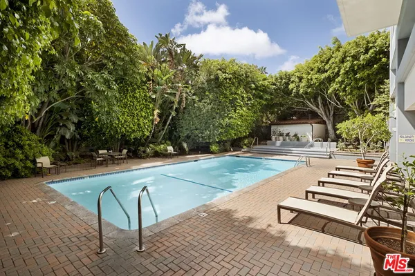a view of patio with swimming pool