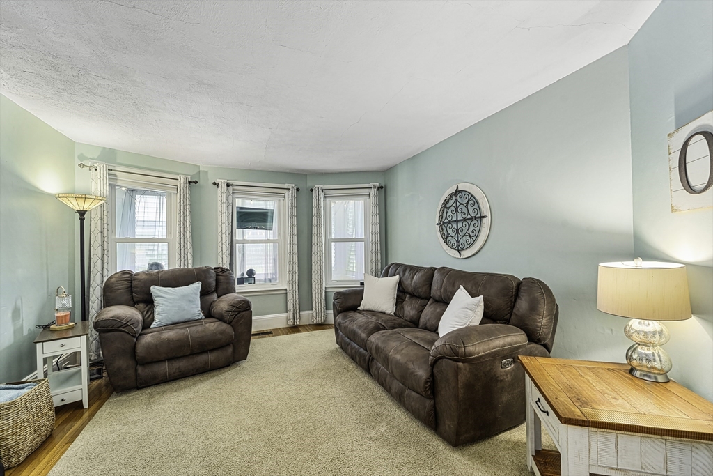 4 Collins Street Amesbury, MA 01913 - Photo 11 of 32 a living room with furniture and a window