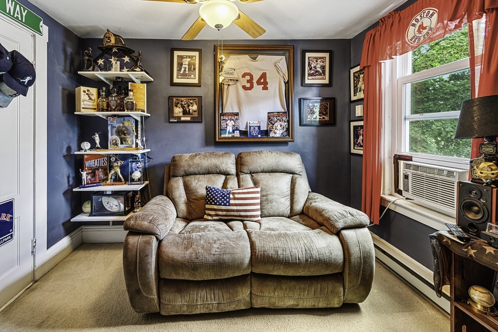 4 Collins Street Amesbury, MA 01913 - Photo 21 of 32 a bedroom with furniture and a bed