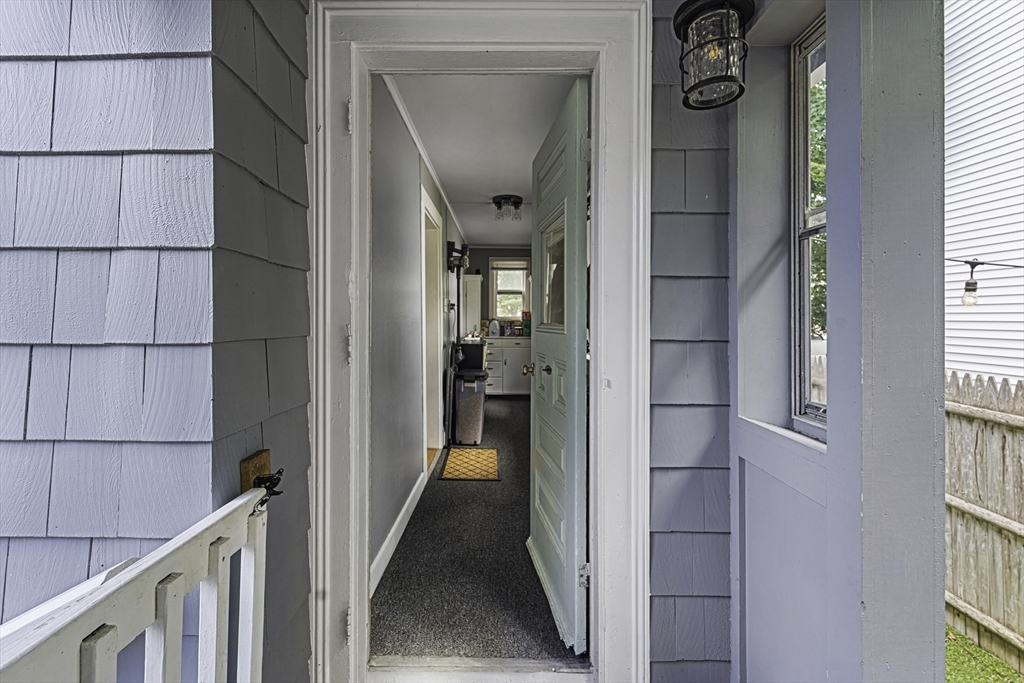 4 Collins Street Amesbury, MA 01913 - Photo 27 of 32 a view of a hallway with a white walls and a window
