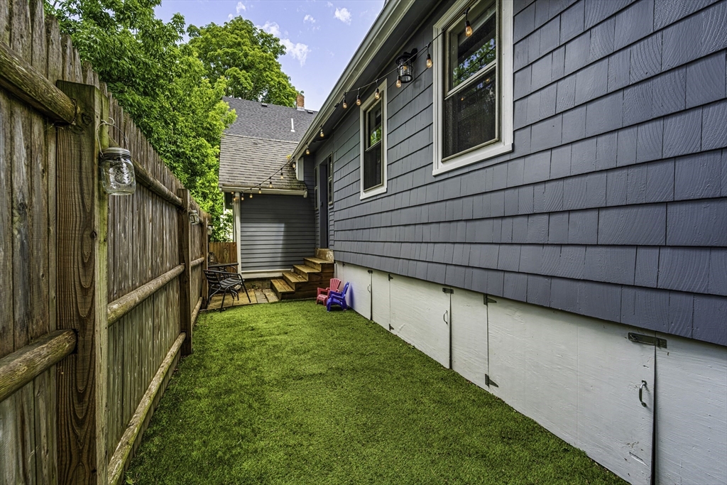 4 Collins Street Amesbury, MA 01913 - Photo 29 of 32 a view of backyard with cabin and wooden fence