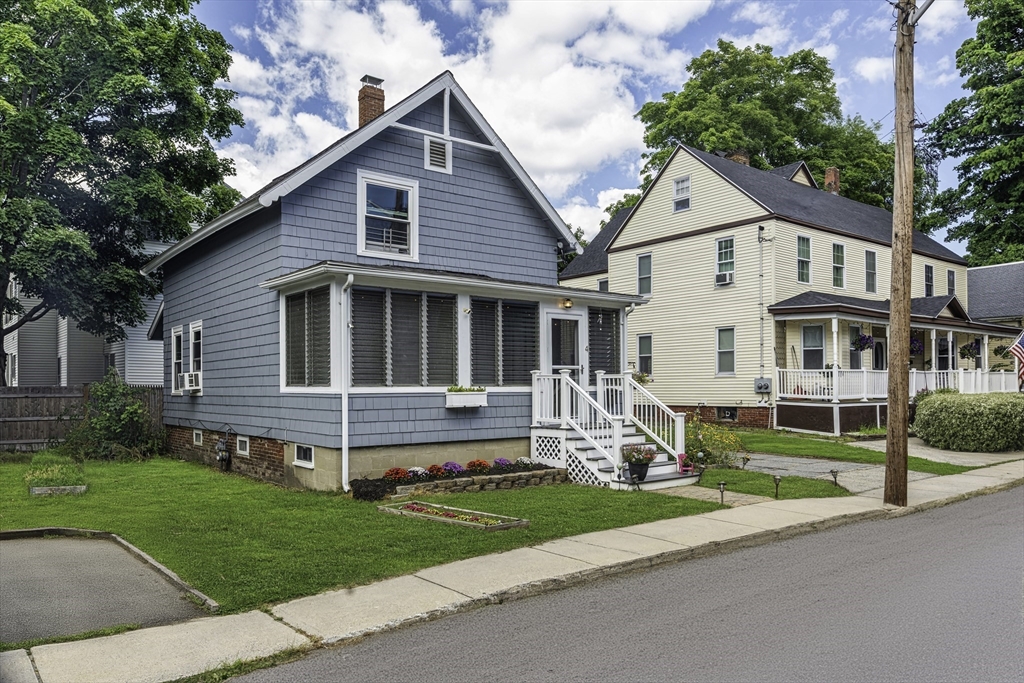 4 Collins Street Amesbury, MA 01913 - Photo 30 of 32 a view of a house with a yard and plants