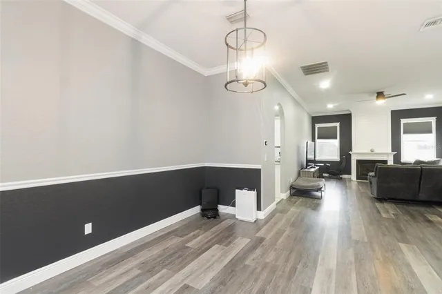 a view of a living room and wooden floor