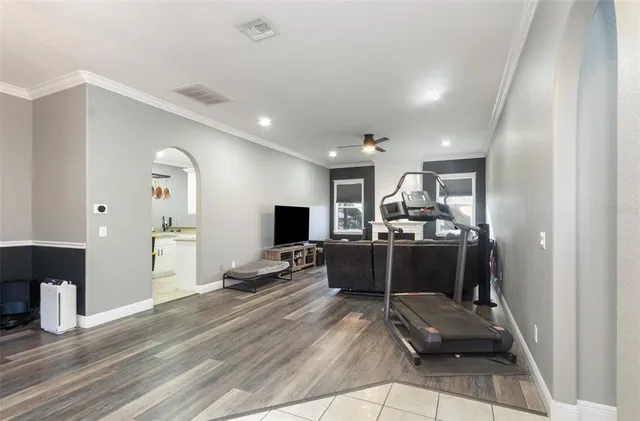 a living room with furniture flat screen tv and outdoor view