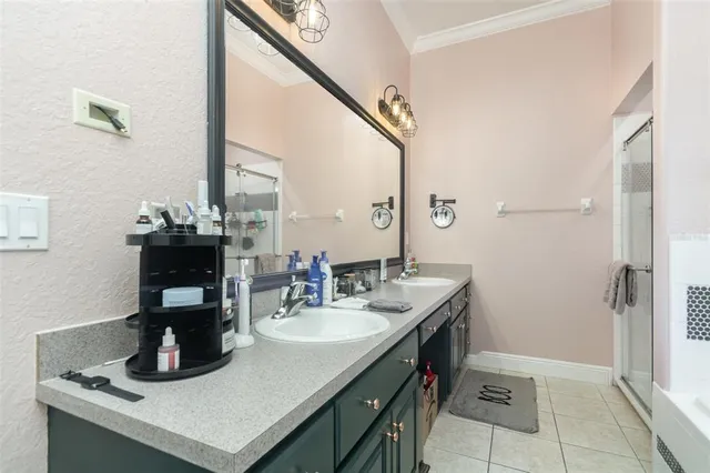 a bathroom with a sink double vanity and a mirror