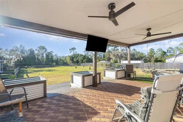 a view of a swimming pool and a patio