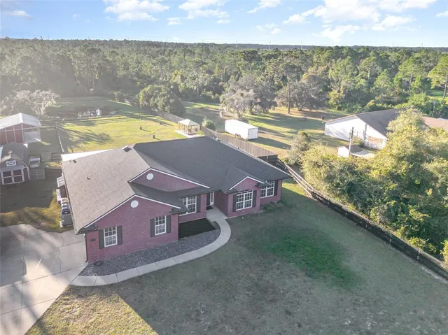 a view of residential houses with outdoor space