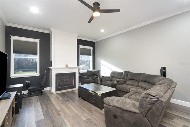 a living room with furniture and a fireplace