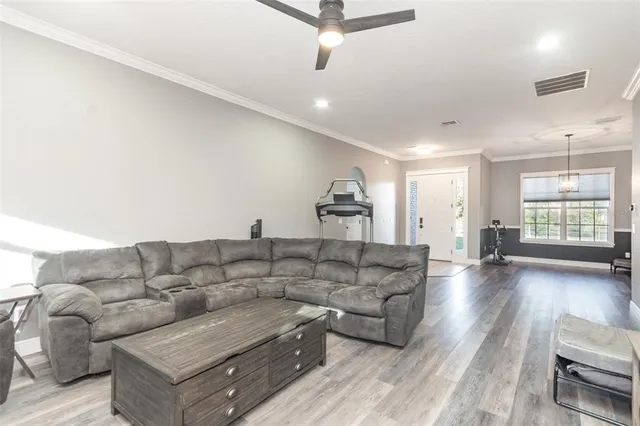 a living room with furniture and a window