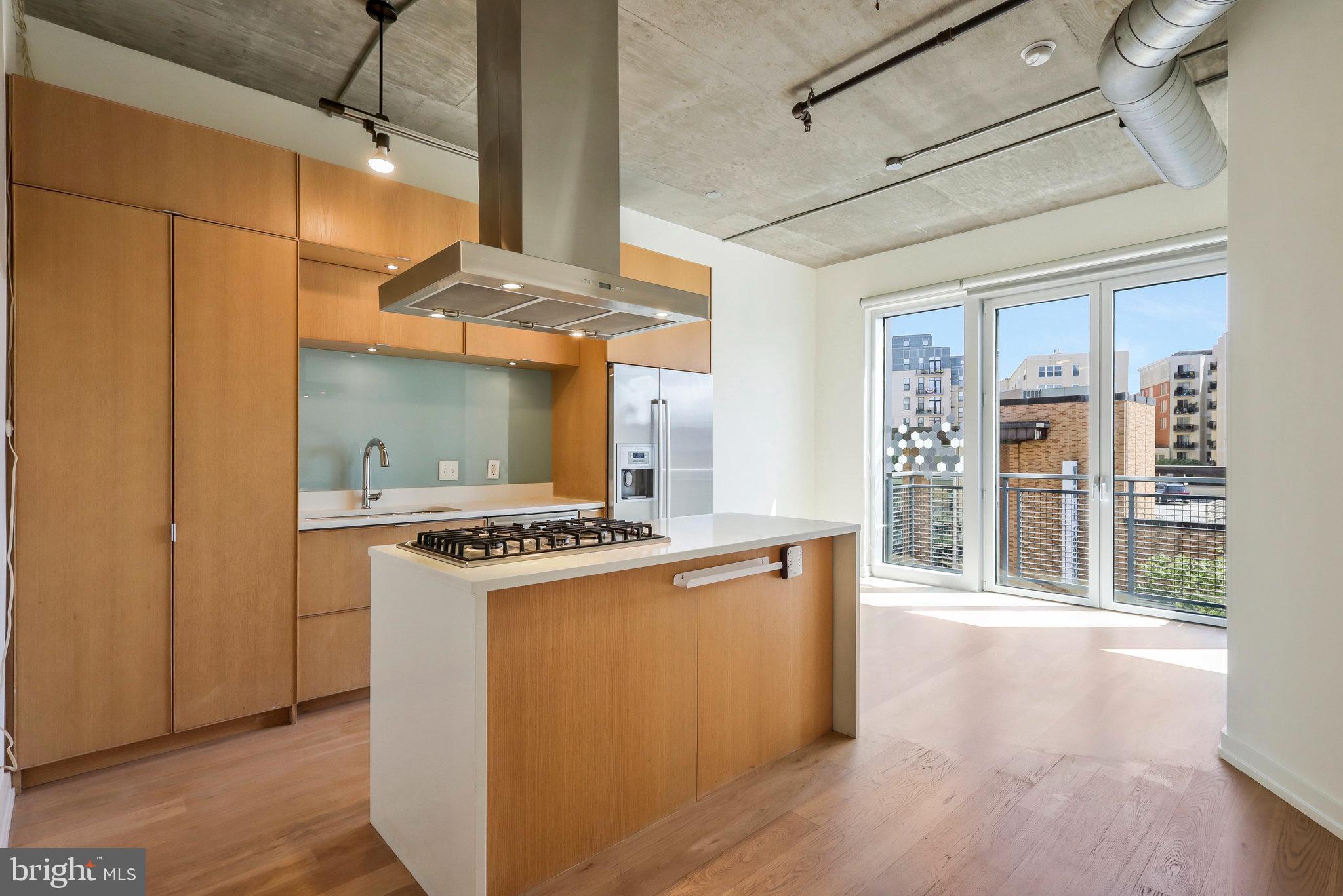 Modern kitchen with urban skyline views.