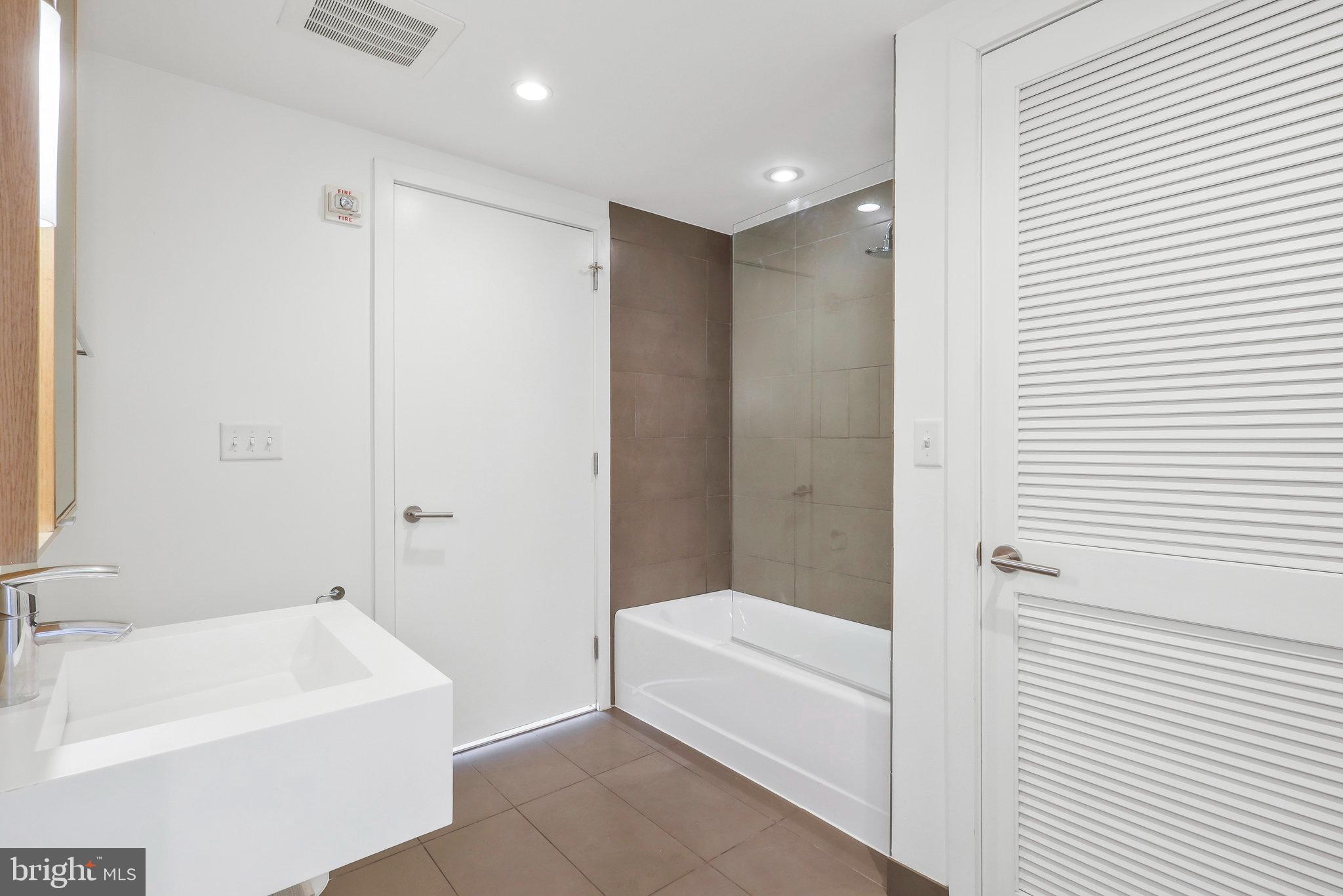 1515 15th Street Northwest, Unit 428 Washington, DC 20005 - Photo 15 of 30 Sleek modern bathroom with elegant finishes.