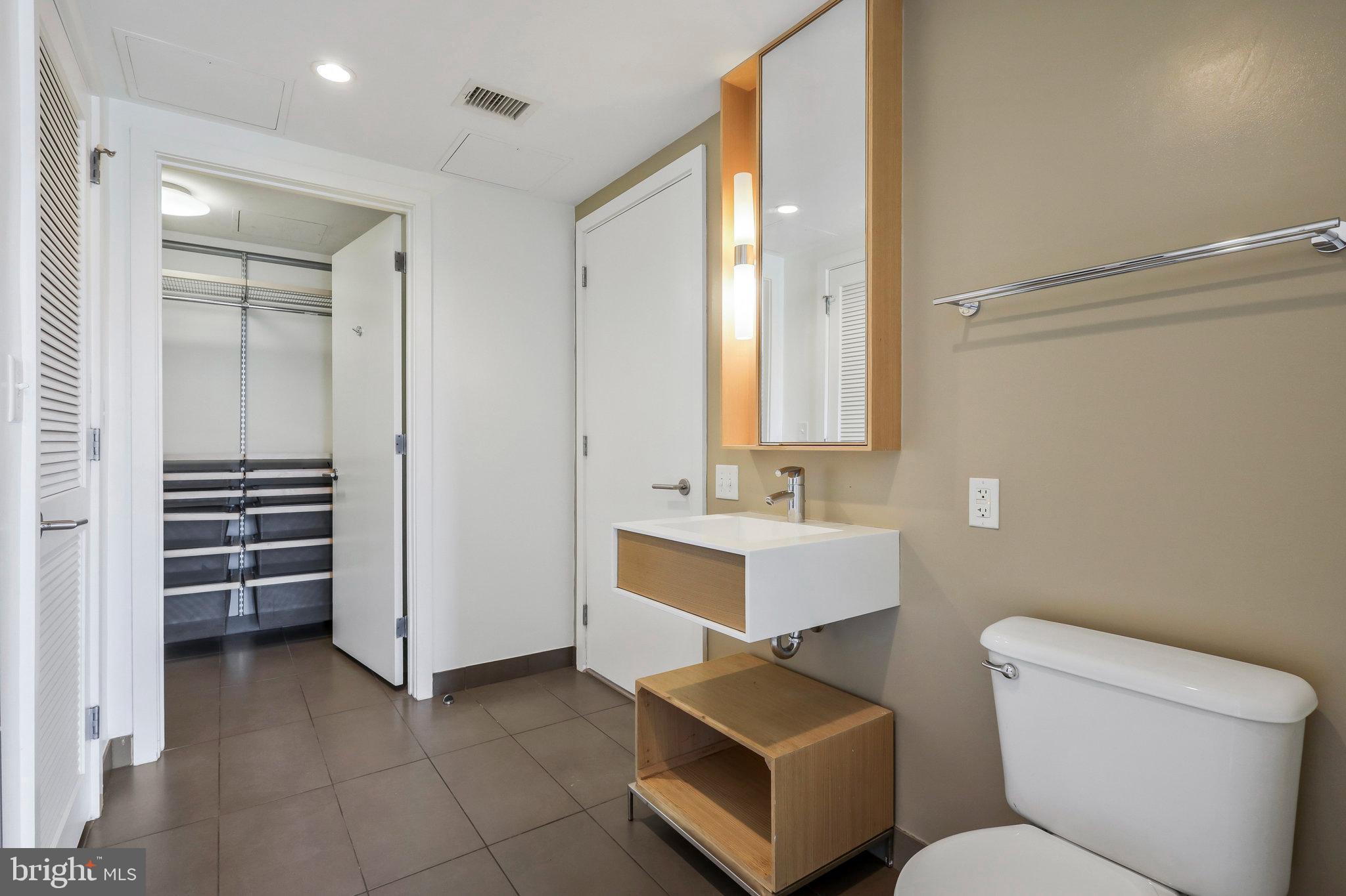 1515 15th Street Northwest, Unit 428 Washington, DC 20005 - Photo 17 of 30 Sleek modern bathroom with ample storage.