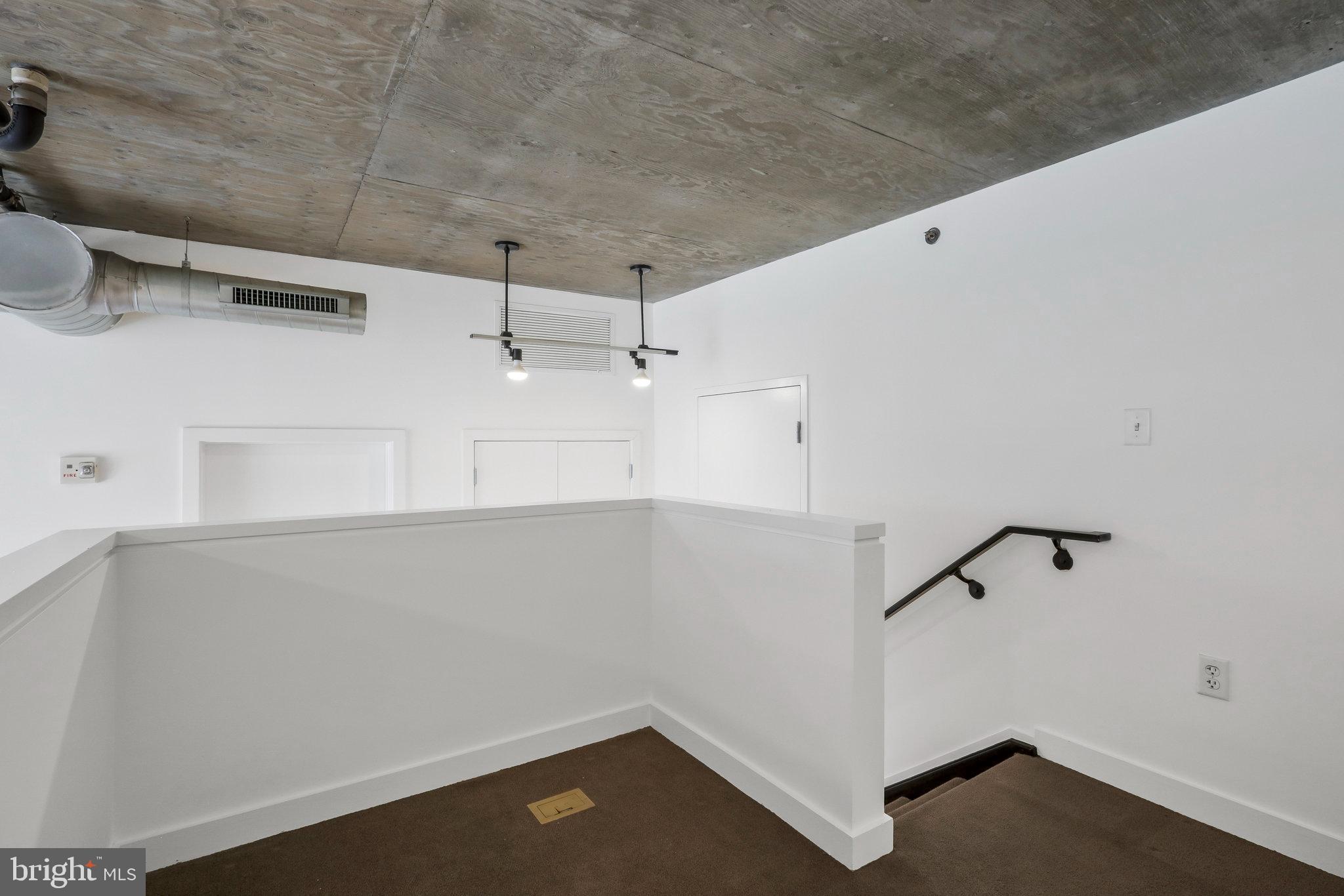 1515 15th Street Northwest, Unit 428 Washington, DC 20005 - Photo 19 of 30 Modern staircase to Den, w/ sleek design elements.