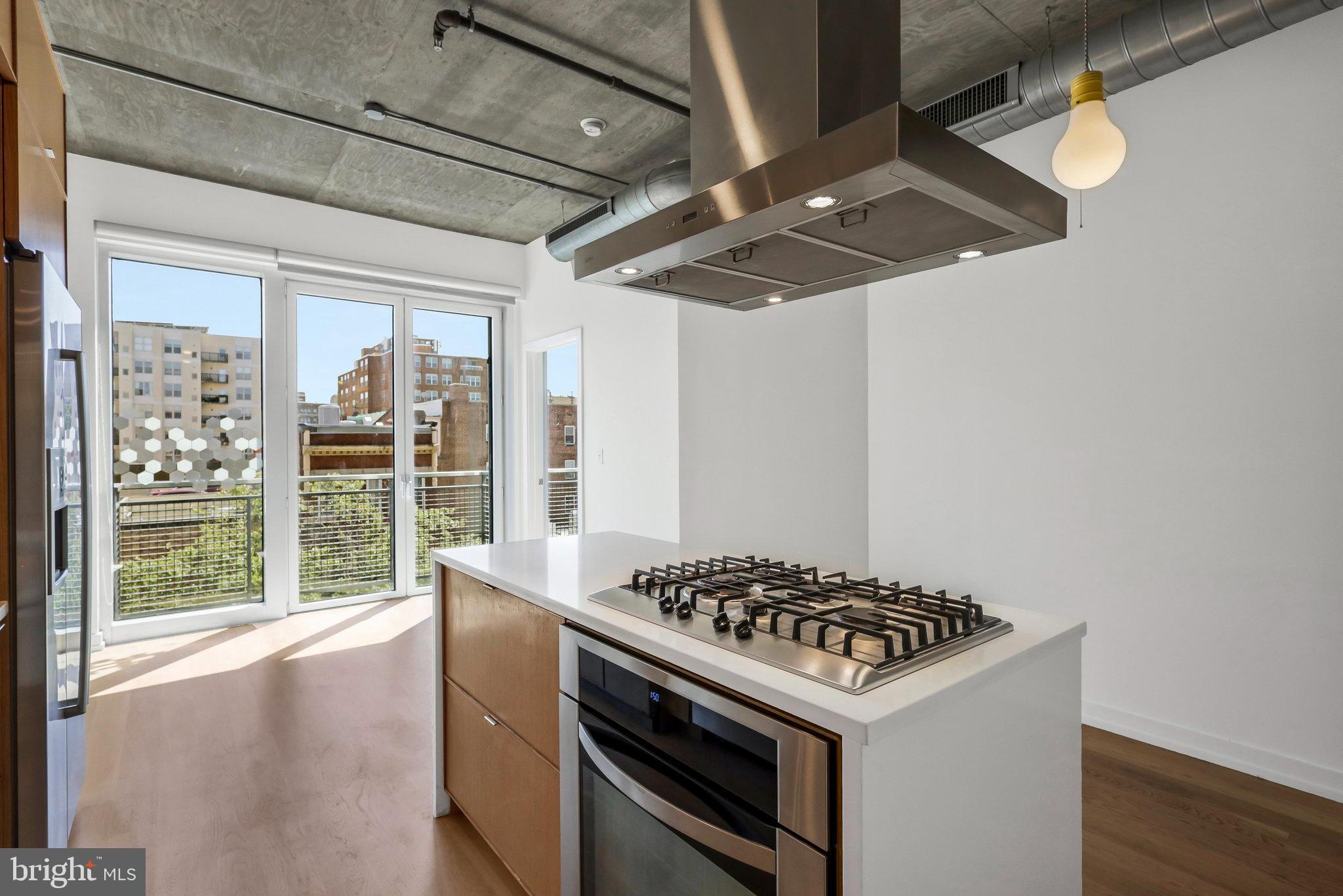 1515 15th Street Northwest, Unit 428 Washington, DC 20005 - Photo 7 of 30 Sleek kitchen with urban views and light.