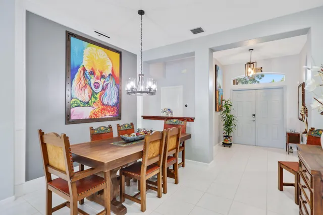 a living room with furniture a flat screen tv and a large window