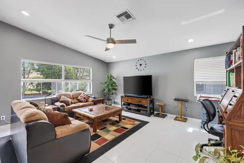 a bathroom with a sink mirror and toilet
