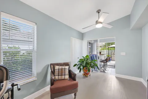 a view of a swimming pool with a patio and a yard
