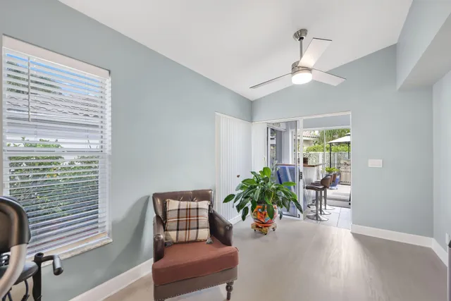 a view of a swimming pool with a patio and a yard