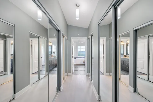 a front view of a house with swimming pool and porch