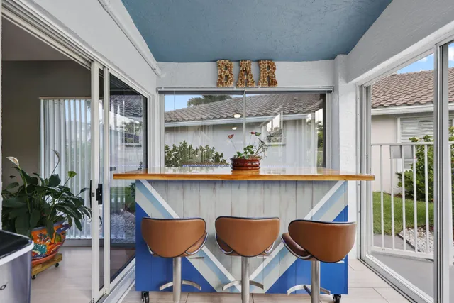 a view of a patio with a table and chairs