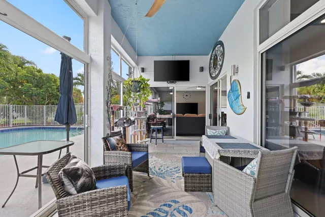 a view of a field of grass and trees