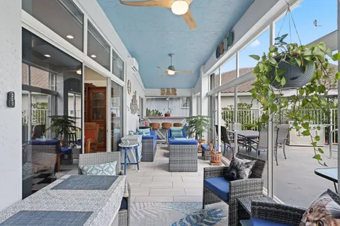 an aerial view of a house with swimming pool garden and patio