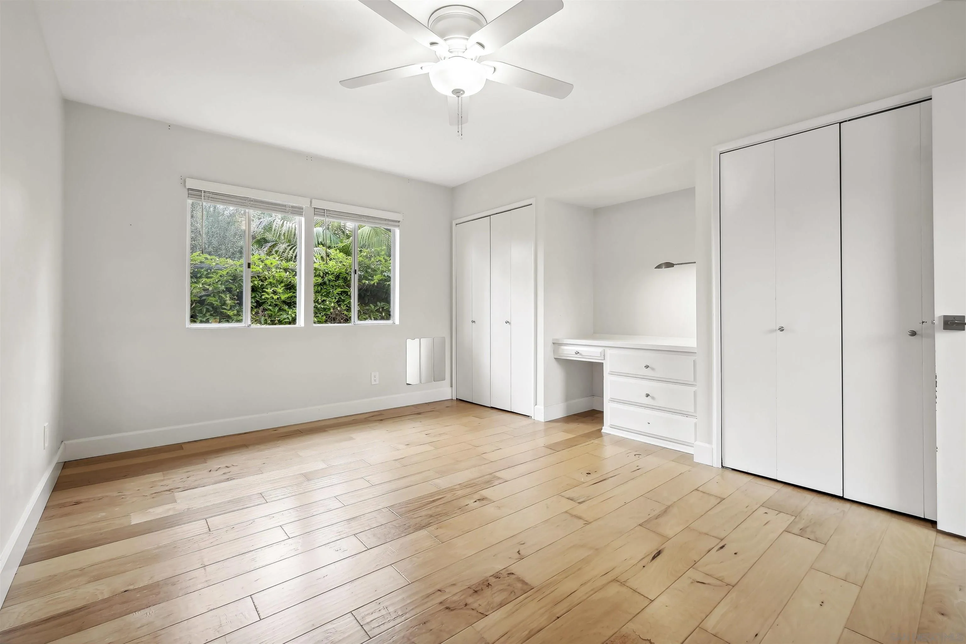 838 Lamplight Drive La Jolla, CA 92037 - Photo 35 of 42 wooden floor in an empty room with a window