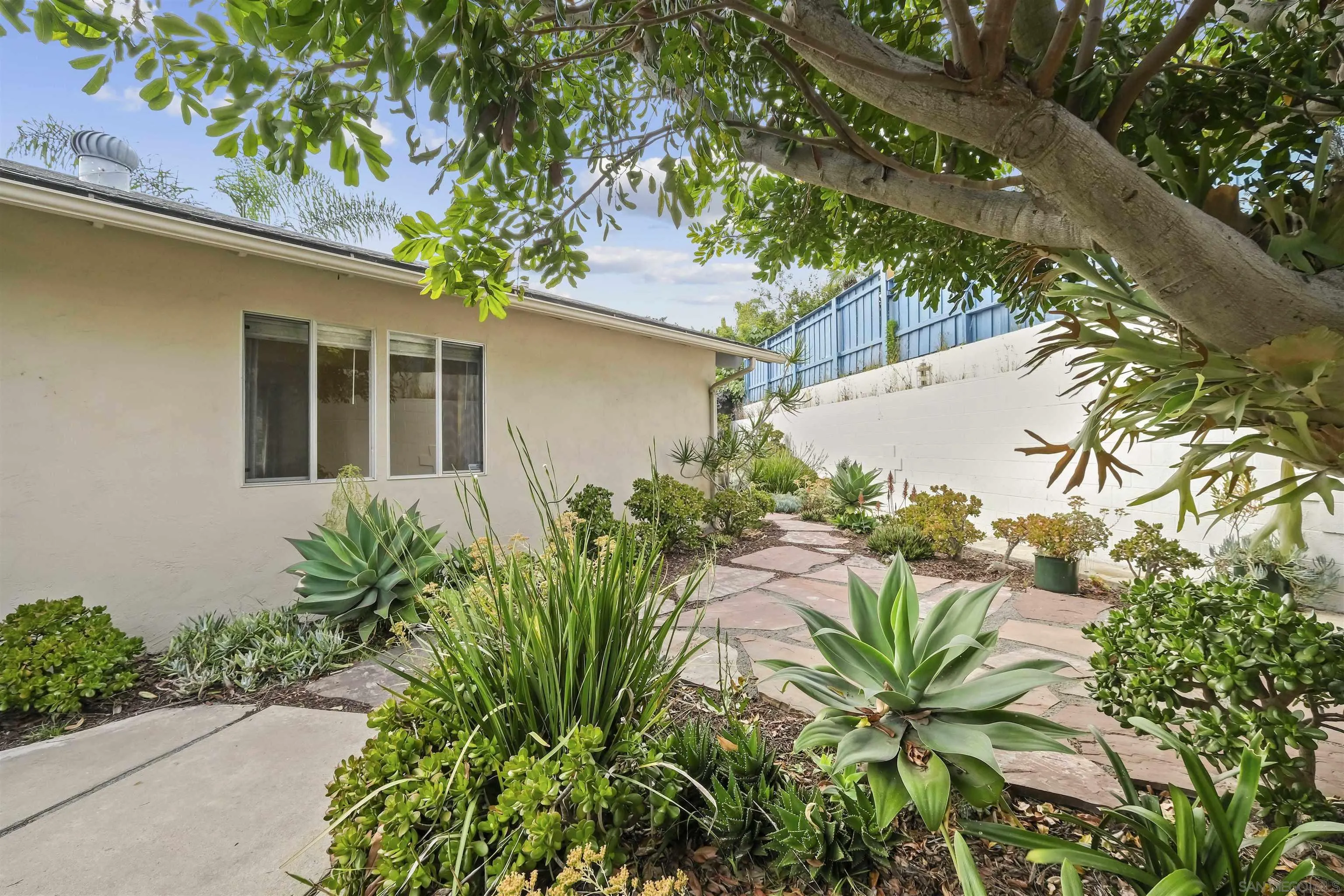 838 Lamplight Drive La Jolla, CA 92037 - Photo 5 of 42 a front view of a house with a yard