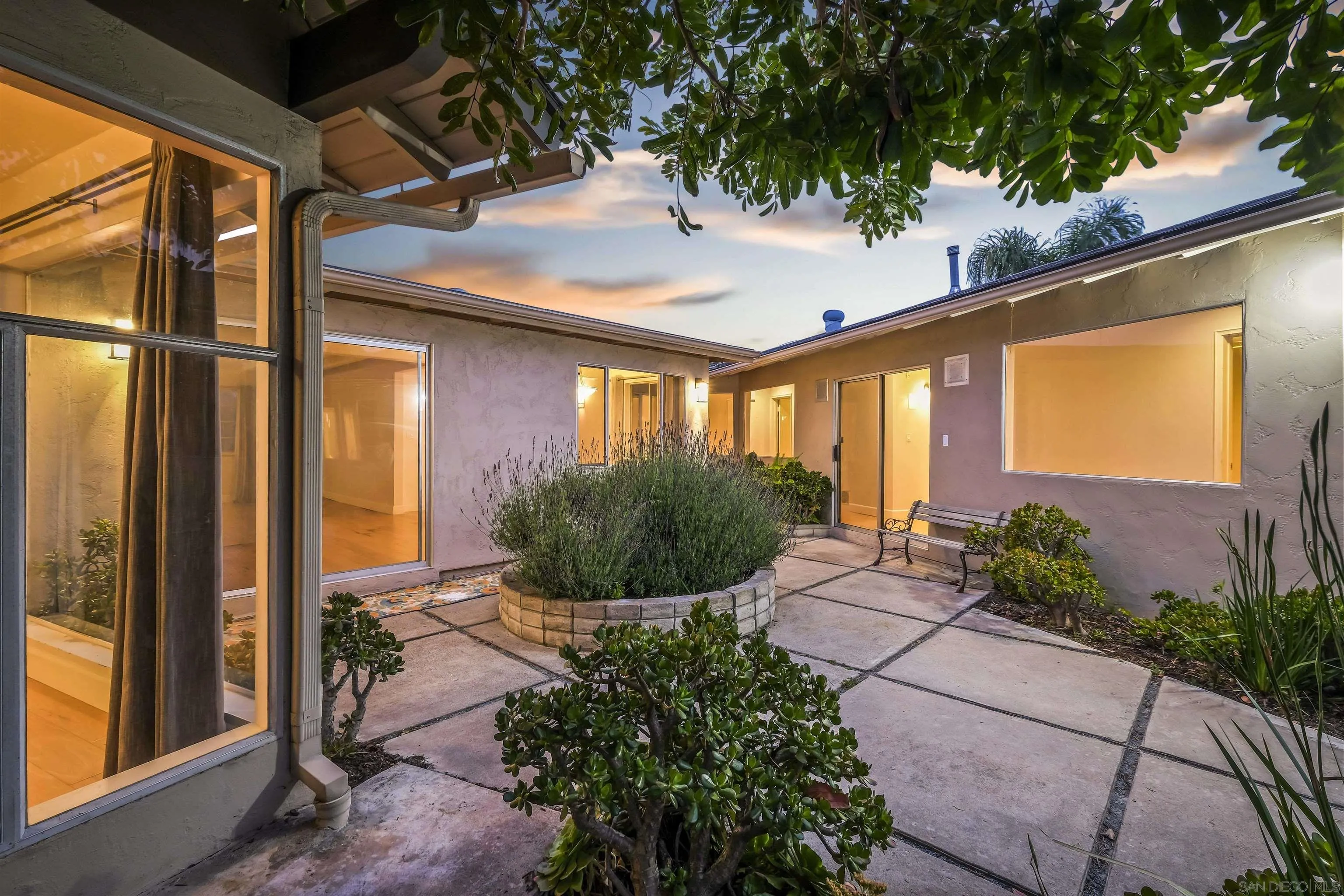 838 Lamplight Drive La Jolla, CA 92037 - Photo 9 of 42 a front view of a house with garden