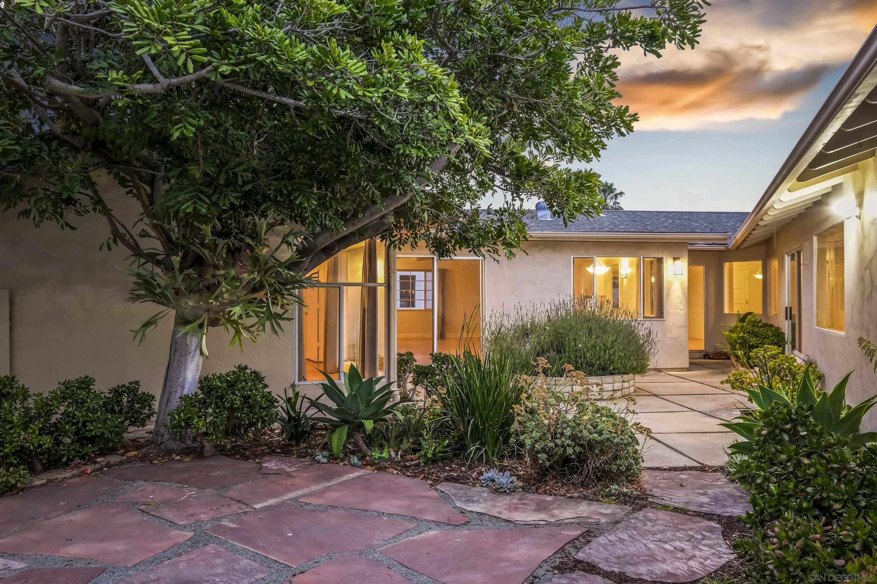 838 Lamplight Drive La Jolla, CA 92037 - Photo 10 of 42 a front view of a house with garden