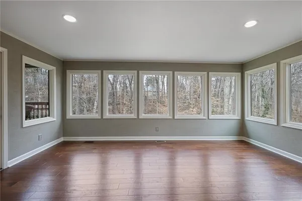a dining room with furniture and a chandelier