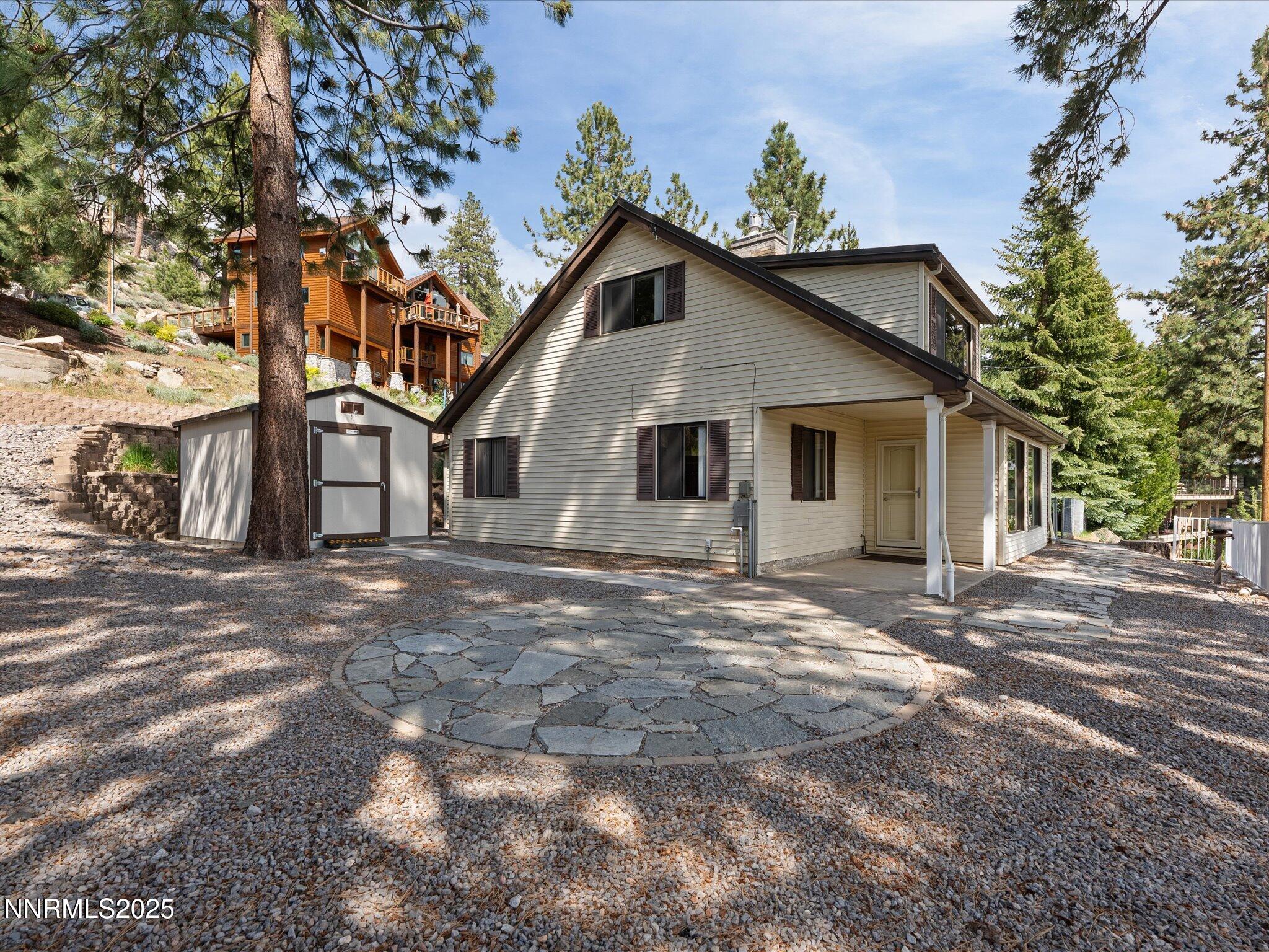 605 Jerry Drive Zephyr Cove, NV 89448 - Photo 11 of 61 a view of a house with a yard and large tree