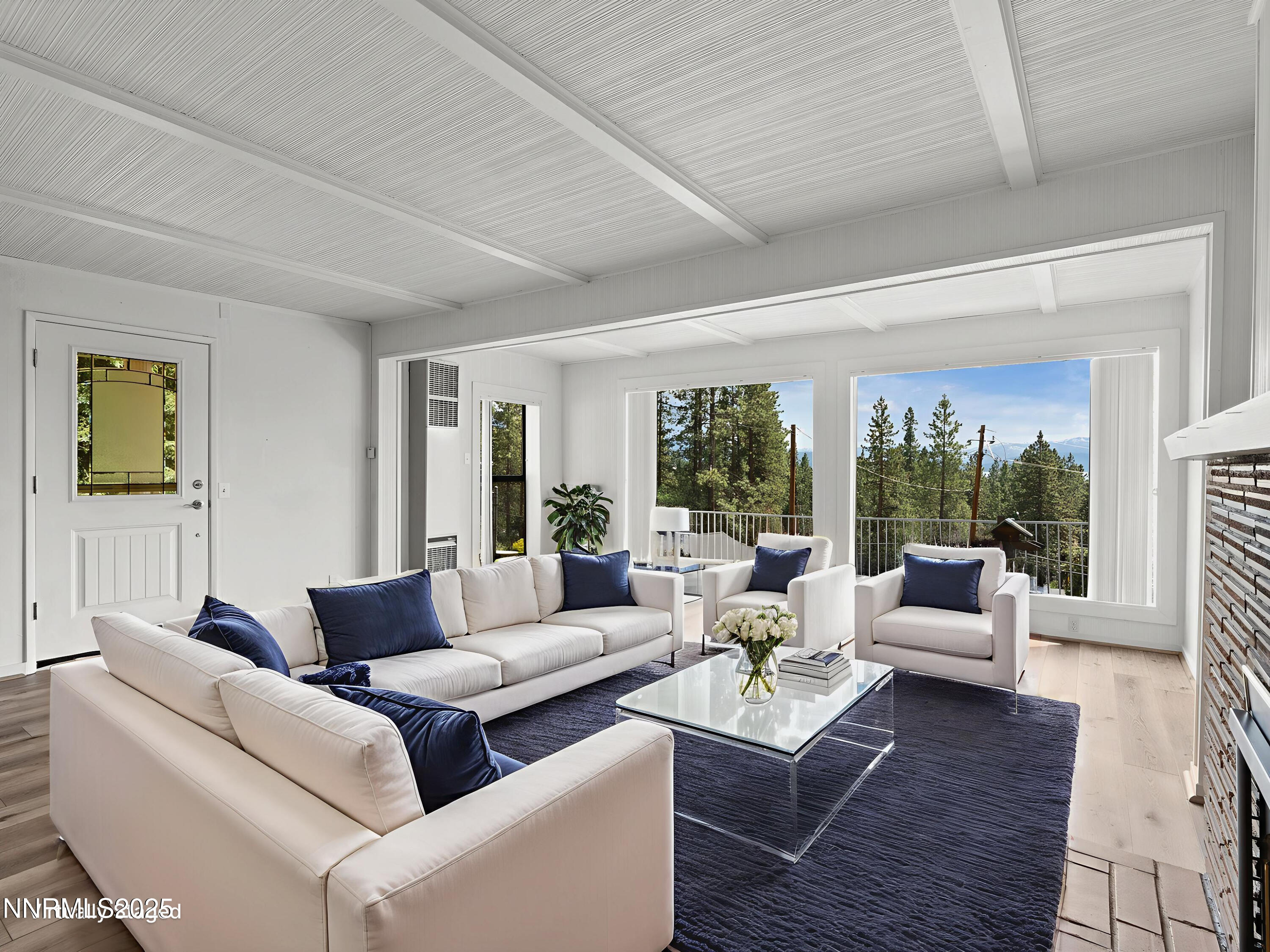 605 Jerry Drive Zephyr Cove, NV 89448 - Photo 14 of 61 a living room with furniture and a large window