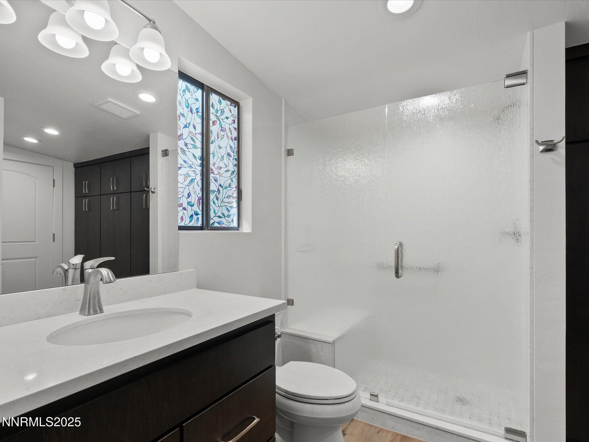 605 Jerry Drive Zephyr Cove, NV 89448 - Photo 17 of 61 a bathroom with a sink a toilet and shower