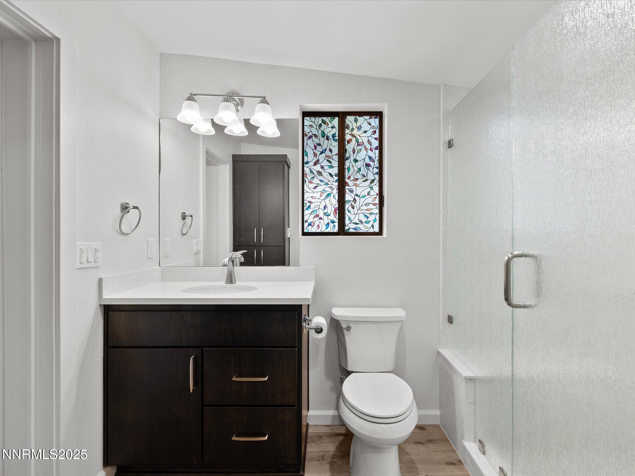 605 Jerry Drive Zephyr Cove, NV 89448 - Photo 19 of 61 a bathroom with a sink toilet and a mirror