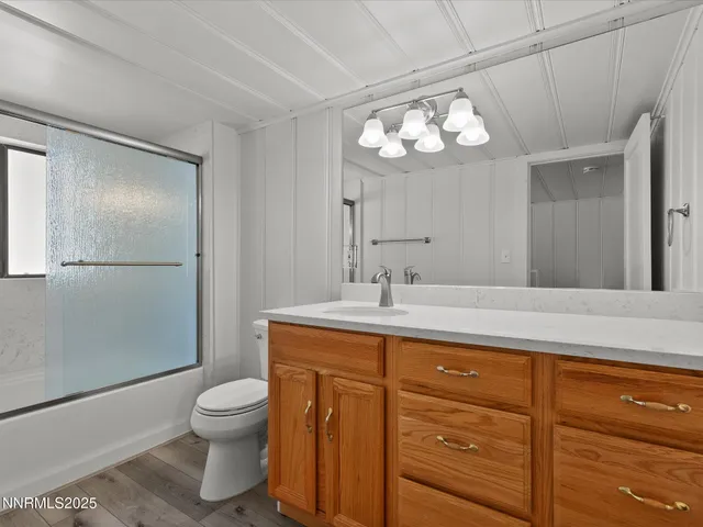 a view of roof deck with wooden floor and fence