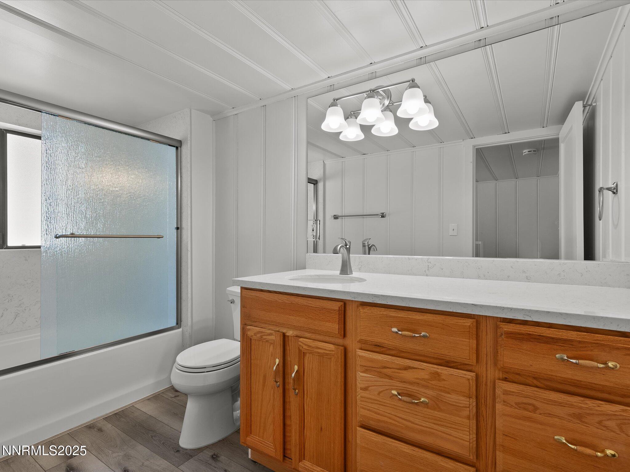 605 Jerry Drive Zephyr Cove, NV 89448 - Photo 21 of 61 a bathroom with a toilet sink and mirror