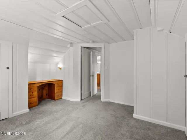 a view of a house with a yard covered in snow