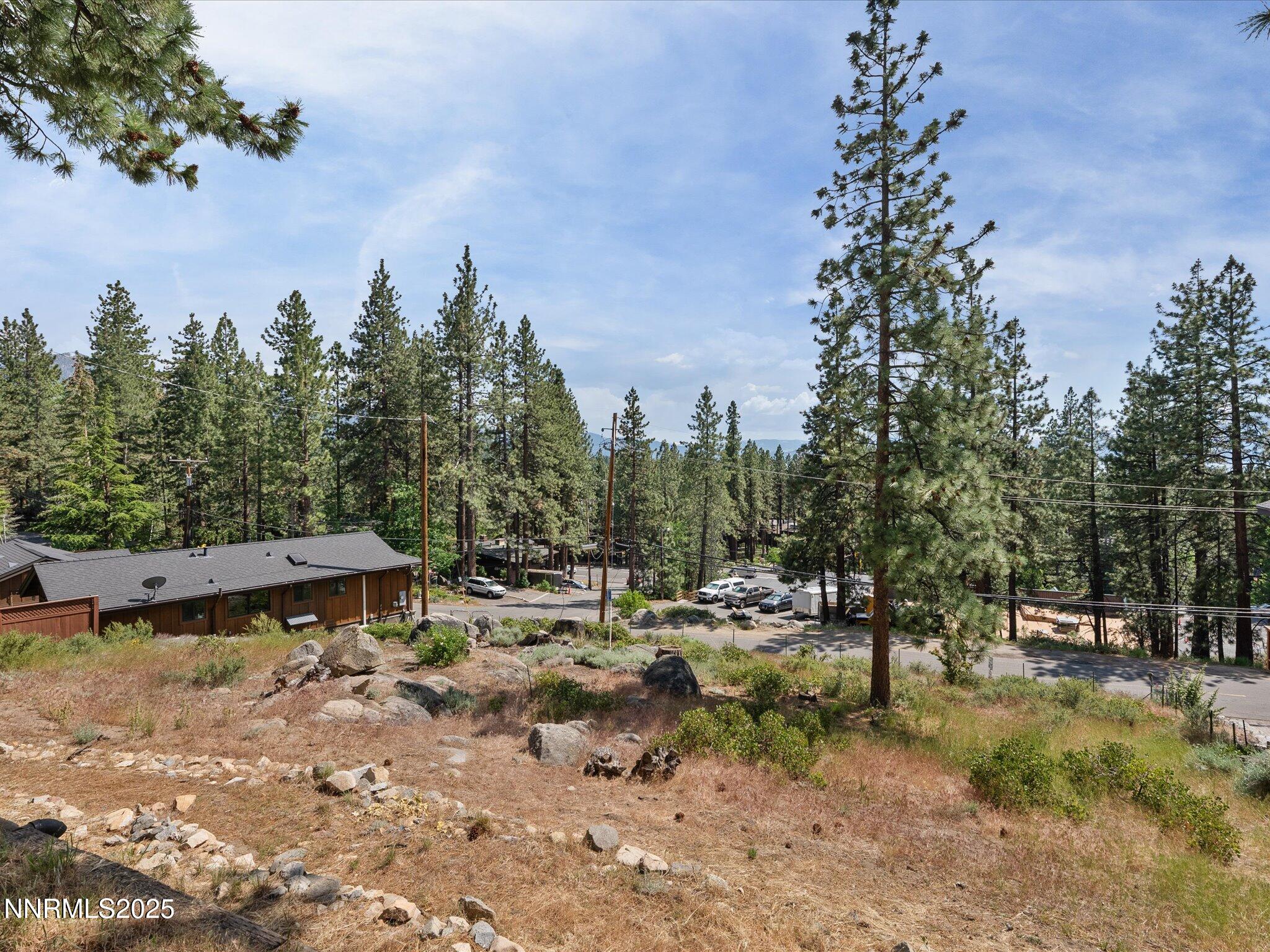 605 Jerry Drive Zephyr Cove, NV 89448 - Photo 40 of 61 a view of swimming pool with outdoor seating and trees in the background