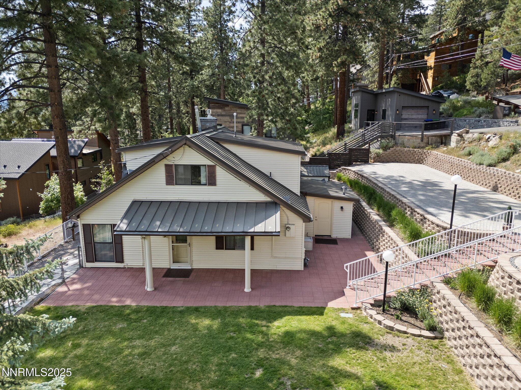 605 Jerry Drive Zephyr Cove, NV 89448 - Photo 48 of 61 a view of house with a yard outdoor seating and entertaining space