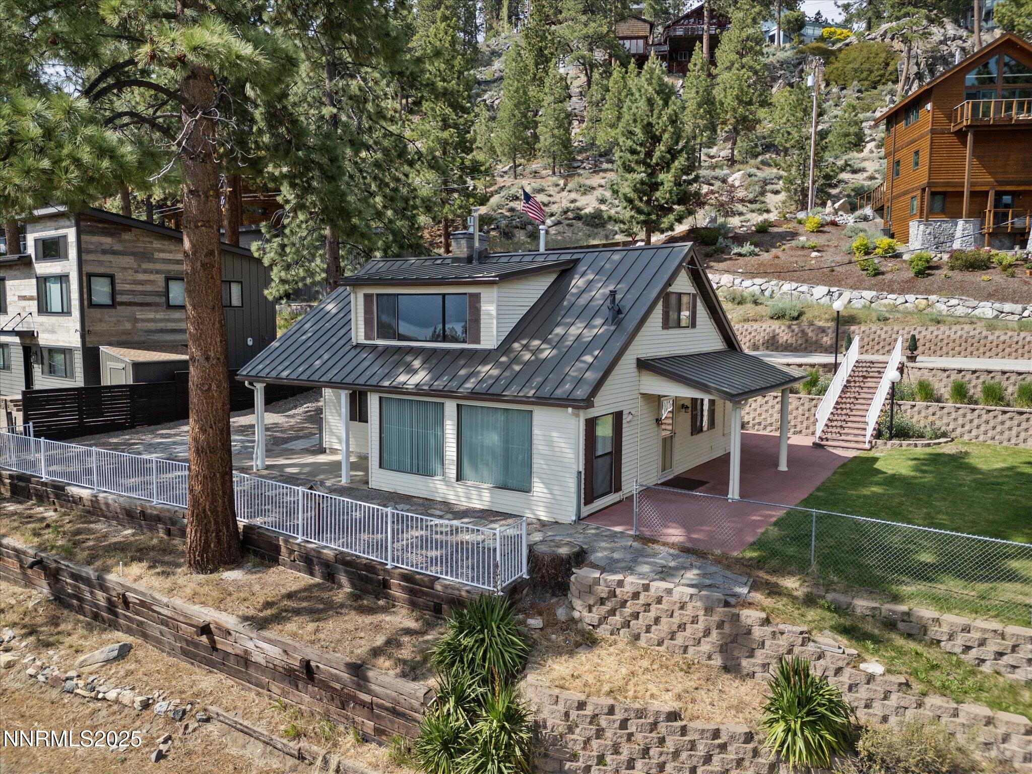 605 Jerry Drive Zephyr Cove, NV 89448 - Photo 49 of 61 a front view of a house with a yard