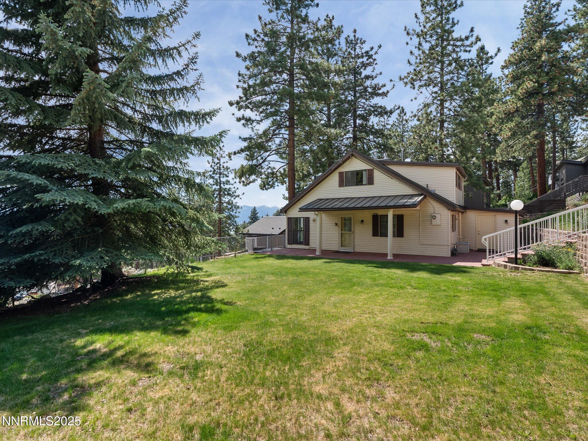 605 Jerry Drive Zephyr Cove, NV 89448 - Photo 6 of 61 a front view of a house with a garden