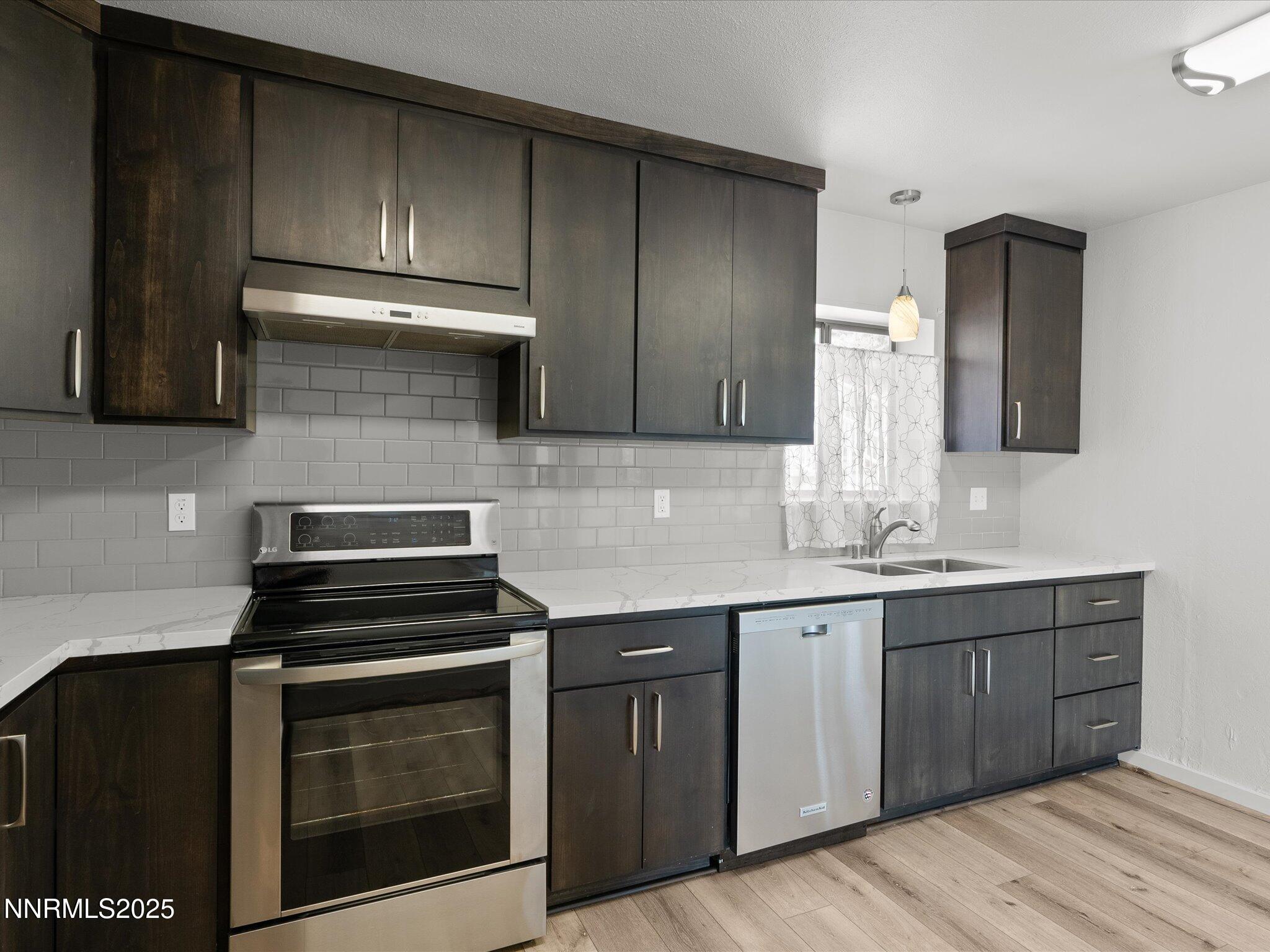 605 Jerry Drive Zephyr Cove, NV 89448 - Photo 9 of 61 a kitchen with cabinets and appliances
