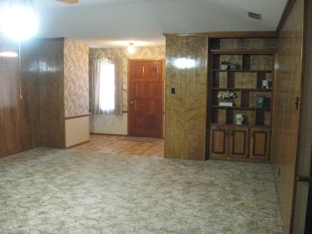 a view of door with wooden floor