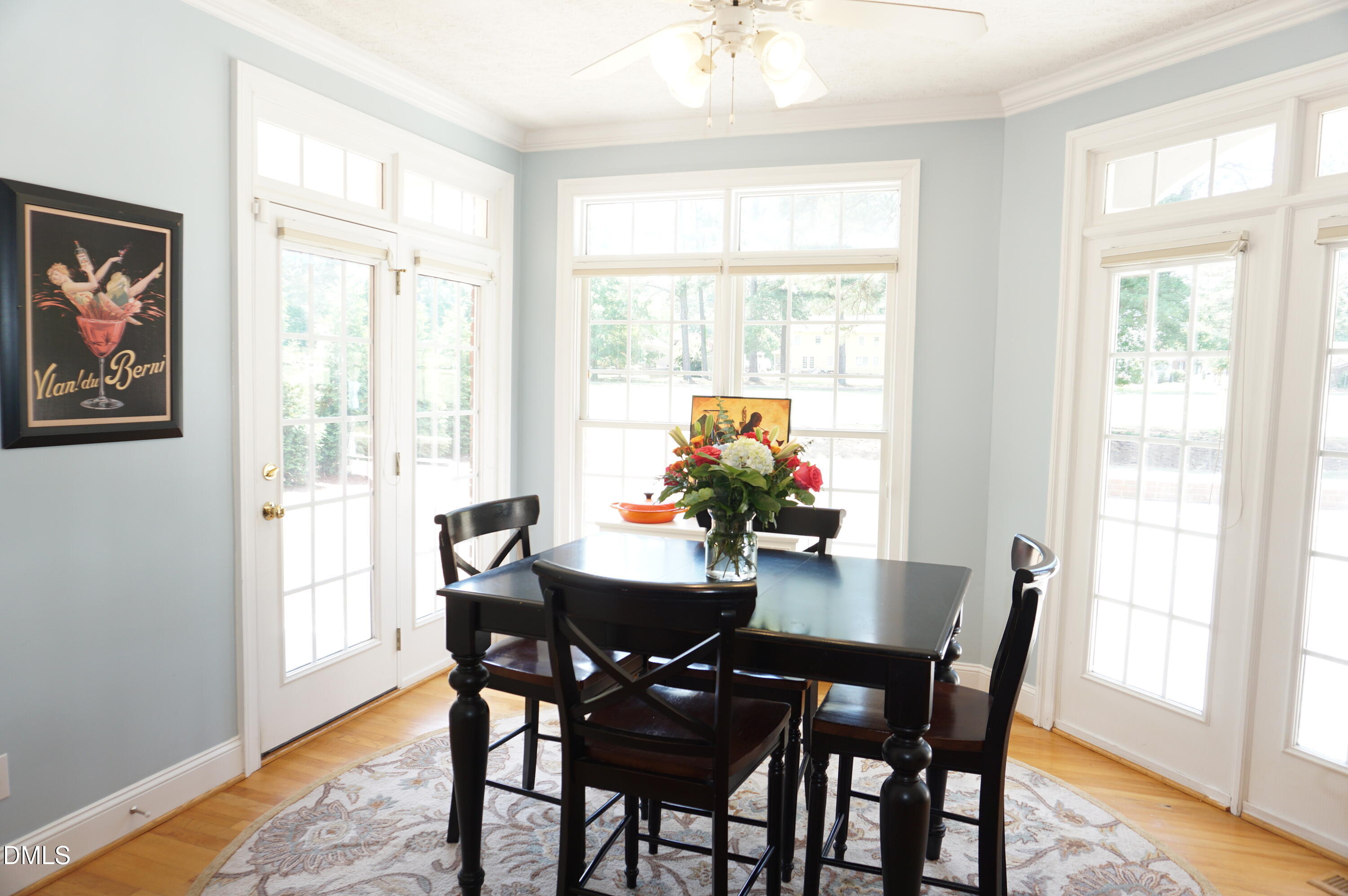 2125 Keith Hills Road Lillington, NC 27546 - Photo 16 of 66 a view of a dining room with furniture window and wooden floor