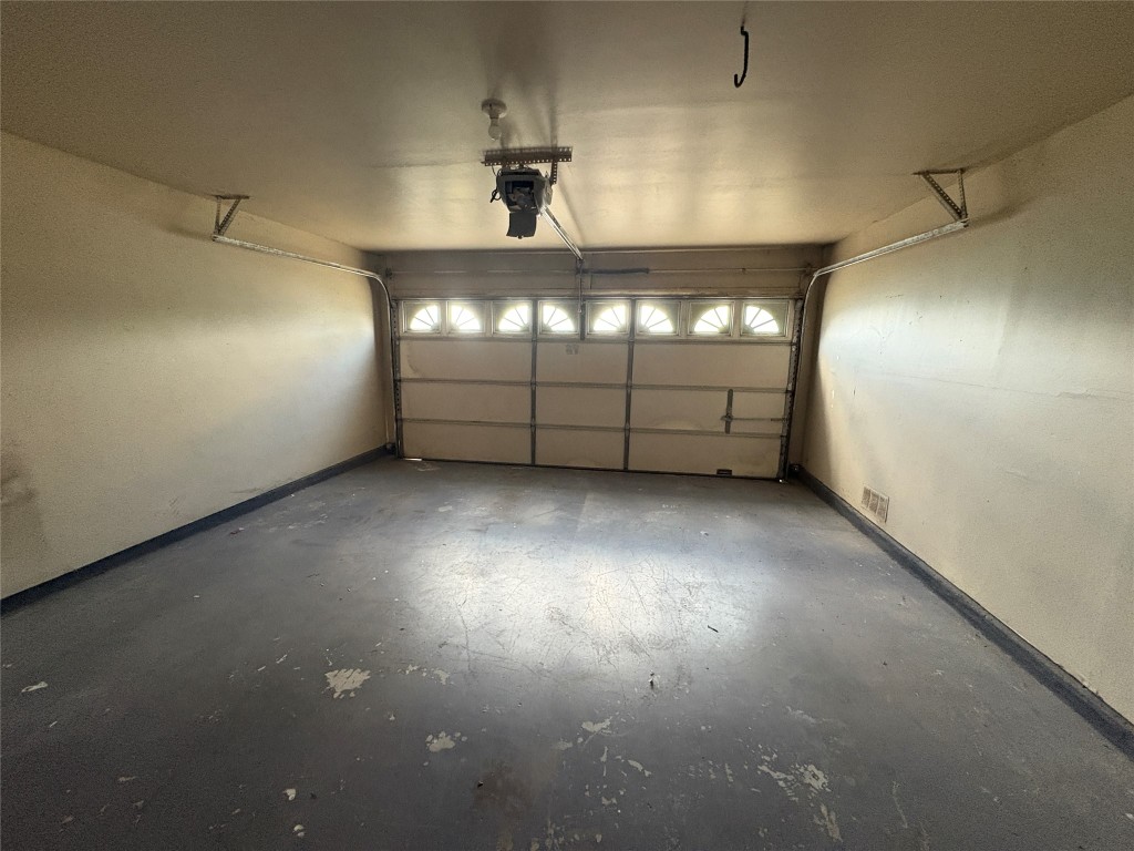 1367 Lakeside Loop Round Rock, TX 78665 - Photo 19 of 19 Garage featuring baseboards