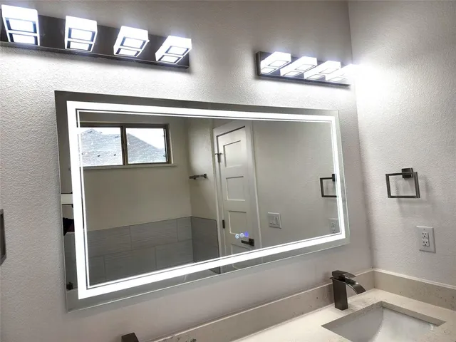 a bathroom with a bathtub and a sink